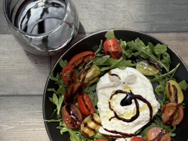 Delicious foods. Cheese, salad and wine