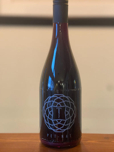 Pet-Nat Red 2017: Bottle shot of 2017 Pet-Nat Red, a carbonated wine made from Marquette grapes at Traynor Family Vineyard.