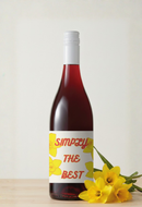 Wine bottle with a label reading 'Simply the Best' and yellow flowers on a light background