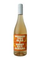 "A bottle of wine with a playful orange label that reads 'Orange You Glad I Didn't Say Banana' in bold white text. The label features a vibrant orange background with repeating banana and orange slice illustrations, creating a fun and whimsical design."