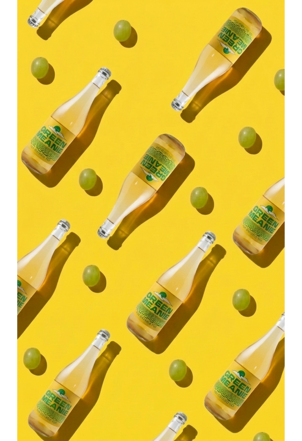 Pattern of beer bottles and green apples on a yellow background