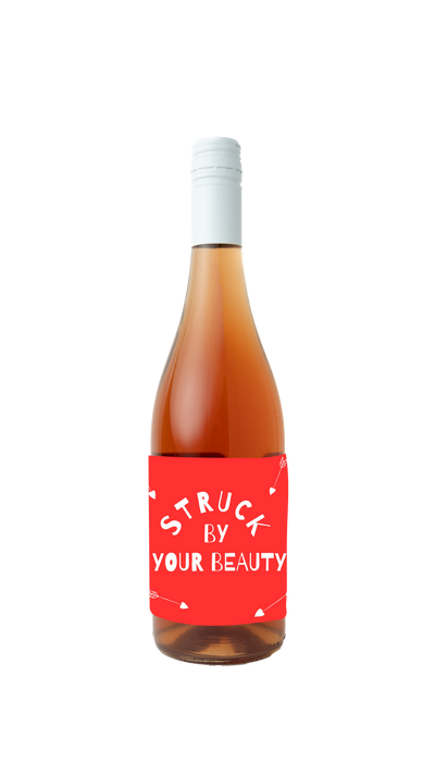 Traynor Rose wine with a right red label that reads 'struck by your beauty' in white