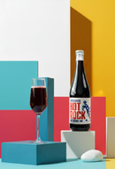 a bottle of Hot Rocket and a glass of wine. 