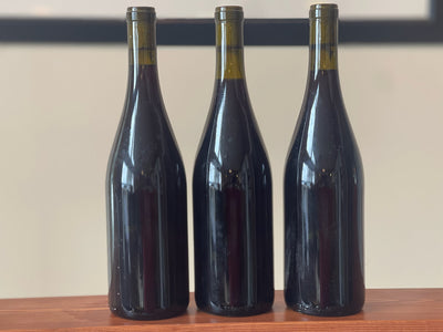 Mystery Red Pack (2015 or Earlier): Image of three unlabelled red wine bottles, possibly from 2015 or earlier.