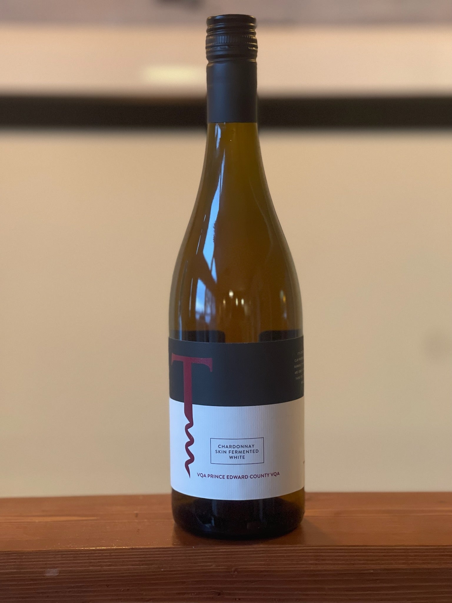 Skin Fermented Chardonnay 2017: Bottle shot of 2017 Skin Fermented Chardonnay, a popular wine at Traynor Family Vineyard.