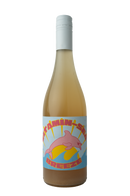 "A bottle of Vitamin Sea Breeze wine with a pale golden hue. The label features a playful design of a pink dolphin leaping over stylized yellow and blue waves, with bold pink and yellow text 'Vitamin Sea Breeze' set against a light blue background with sun rays."