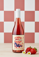 Bottle of wine with a label featuring strawberries and a checkered background