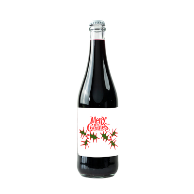 "A bottle of red wine with a festive label that reads 'Merry Christmas' in bold red text. The label features holly leaves and red berries on a white background, adding a classic holiday theme."