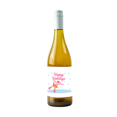 "A bottle of wine with a festive label that reads 'Happy Holidays' in red cursive text. The label features a pink, spotted reindeer ice-skating on a frozen pond, surrounded by light blue snowflakes."