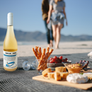 Saltwine on a beach with charcuterie pairing