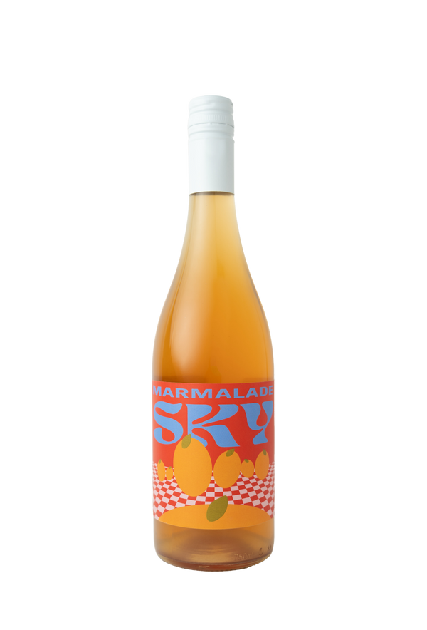 "A bottle of wine labeled 'Marmalade Sky' with a rich orange hue. The label features bold blue text 'SKY' and 'MARMALADE' in white, along with vibrant orange illustrations of citrus fruits set against a red and white checkered background."