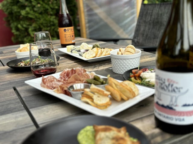 Charcuterie at Traynor Vineyard, with a bottle of wine
