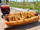 The Kimchi Dog at Traynor Family Vineyard - an all-beef hot dog on a sesame bun loaded with kimchi, chive mayo, toasted sesame seeds, and scallion