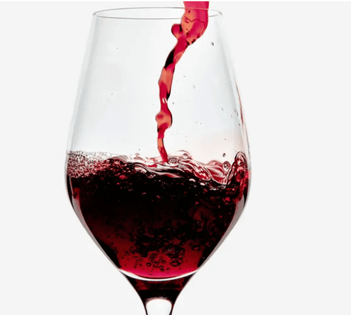 Glass of wine served at Traynor Family Vineyard tasting room in Prince Edward County.